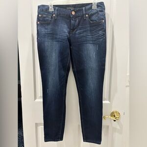 Express Dark Blue Ankle Jeans with slight distressing and zippers at the ankles